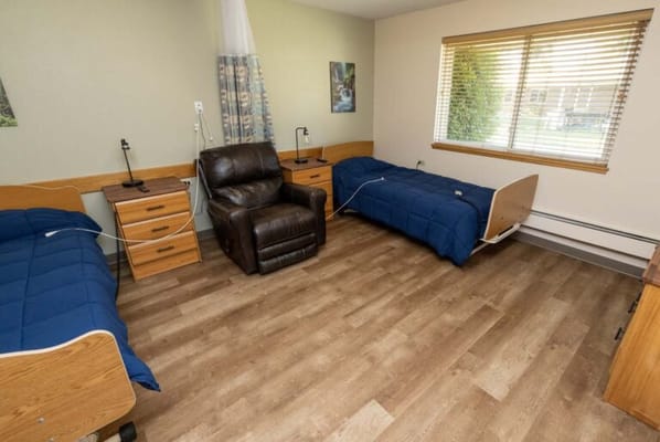Cozy interior of a shared resident room with two beds