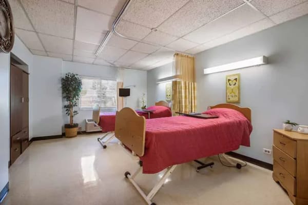 Interior view of a resident room with two beds