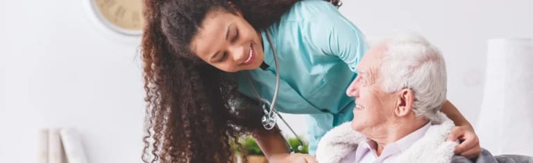 Nurse assisting a senior resident in a cozy living area
