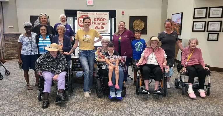 Residents and staff gathered for a group photo during an event
