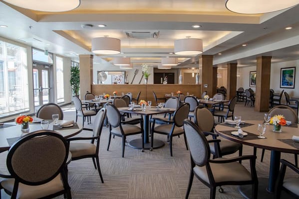 Interior view of a dining room with tables set