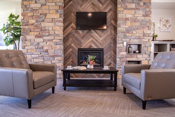 Cozy common area with comfortable seating and a fireplace