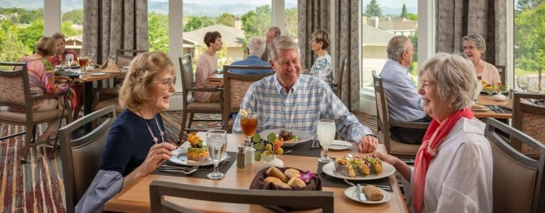 Residents enjoying a meal in a dining room