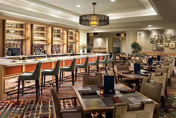 Bright dining area with modern decor and seating