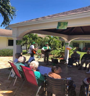 Residents enjoying live music performance outdoors