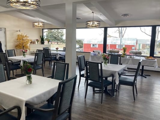 Bright dining room with tables set for meals