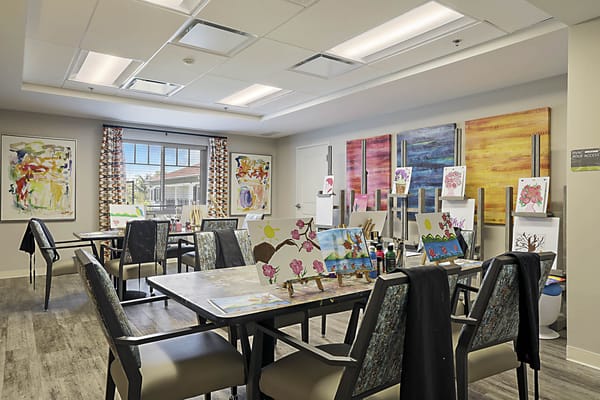 Art activity room with works displayed on tables
