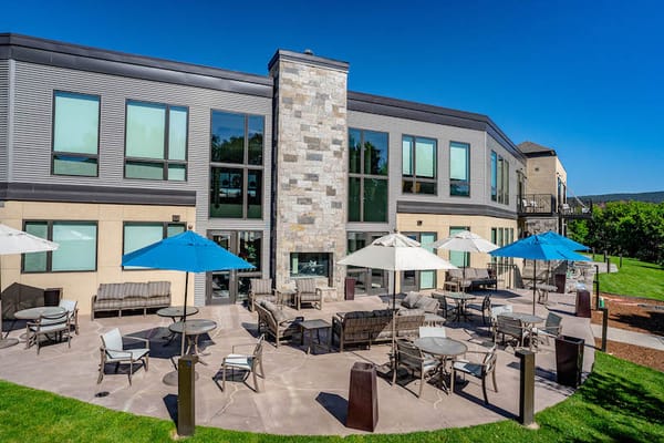 Outdoor seating area with umbrellas at the facility