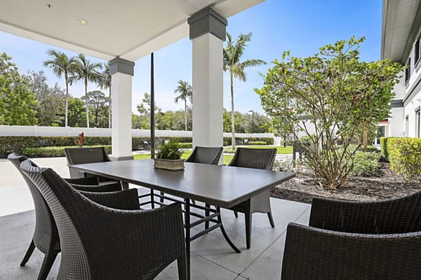 Outdoor seating area with a table and chairs