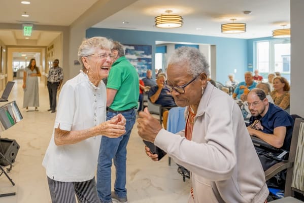 Residents enjoying a dance event in the common area