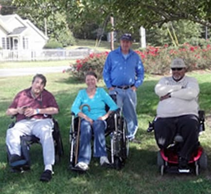 Residents enjoying the outdoor space in wheelchairs
