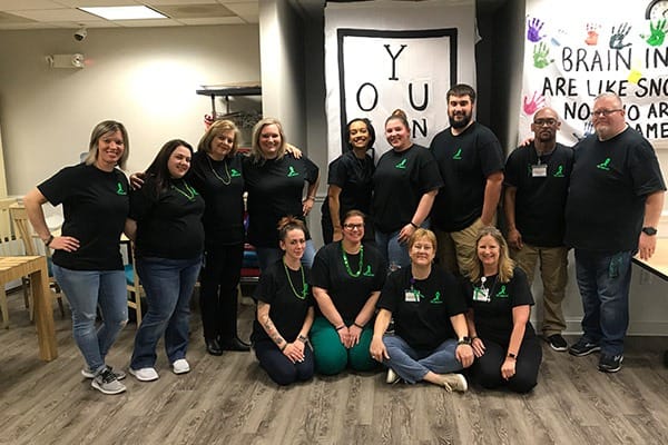 Staff members participating in an activity at the facility