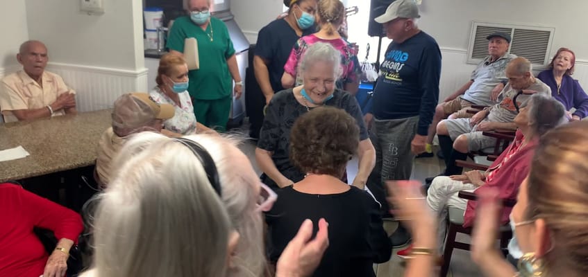 Residents and staff engaging in a lively group activity