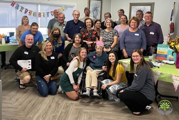 Residents and staff celebrating a birthday party