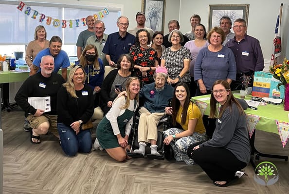 Residents and staff celebrating a birthday party