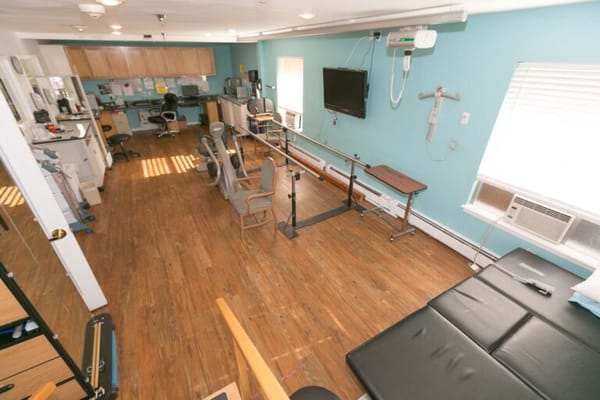 Interior view of a rehabilitation space with exercise equipment