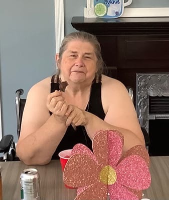 Resident enjoying a snack in a common area