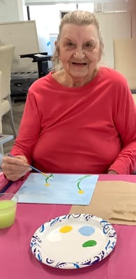 Resident painting during an art activity