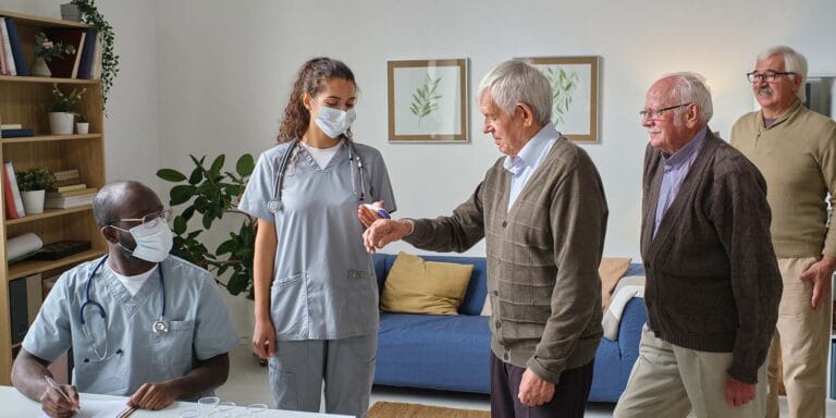 Residents interacting with staff in a common area