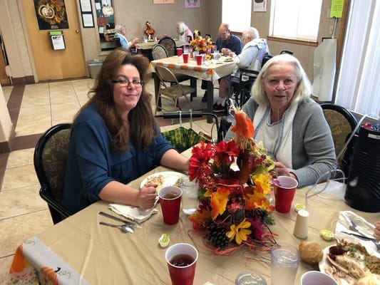 Residents enjoying a meal together in the dining area