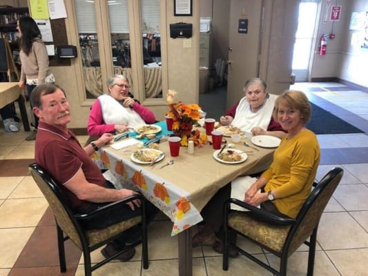 Residents enjoying a meal together in a dining area