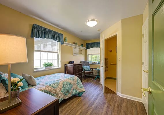 Cozy private resident room with a bed and window