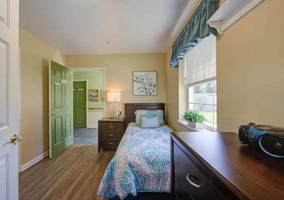 Cozy private resident room with a bed and decor