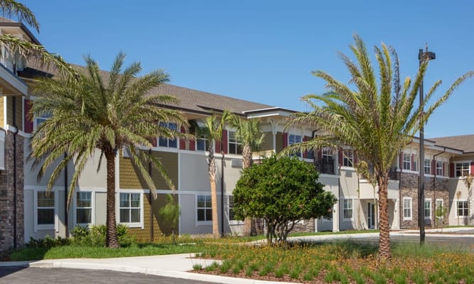 Exterior view of the assisted living facility with landscaping