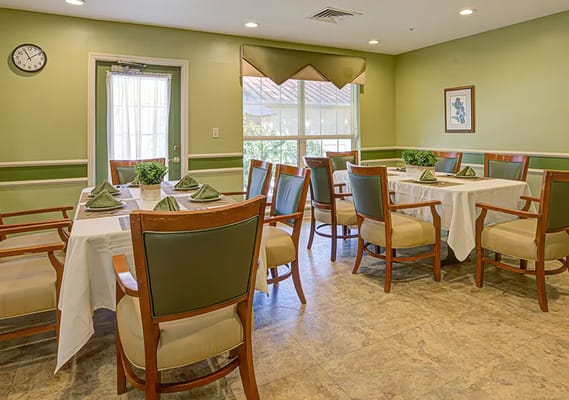 Well-set dining room with tables and chairs