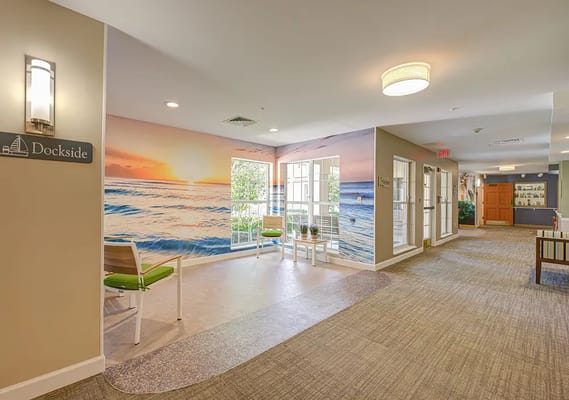 Bright interior common area with coastal mural
