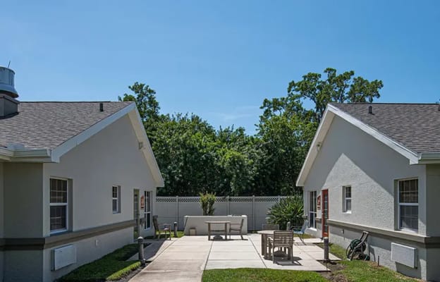 Outdoor space with seating area between buildings