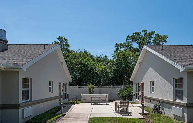 Outdoor space with seating area between buildings