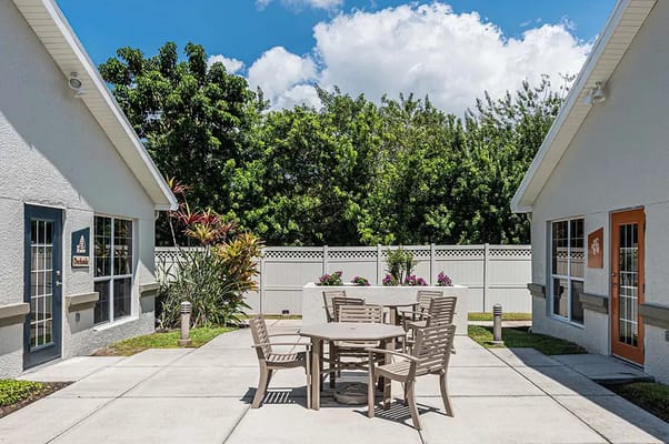 Patio area with seating and greenery