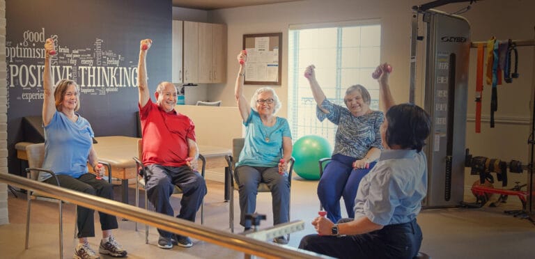 Residents participating in a fitness activity with weights
