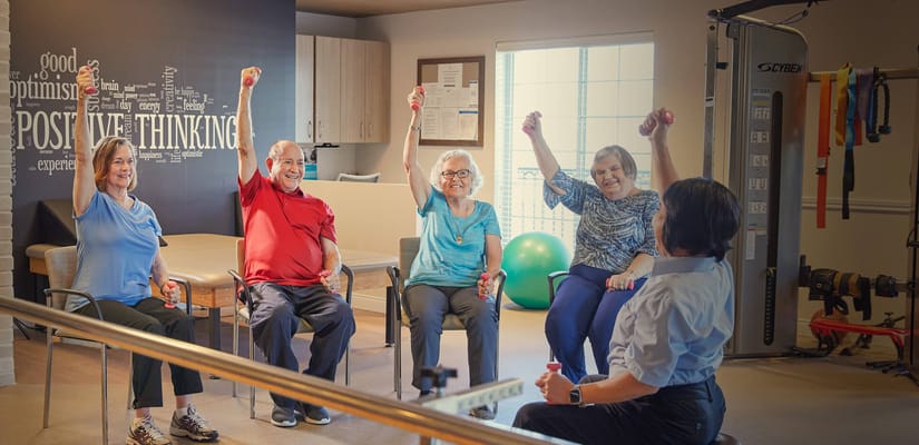 Residents participating in a fitness activity with weights