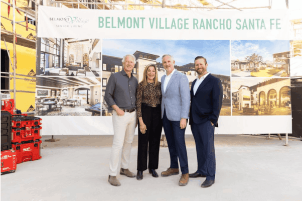 Group of four people at a facility construction site