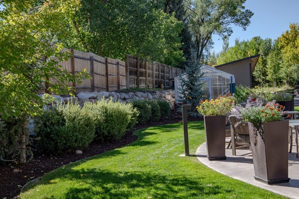 Well-maintained outdoor garden area with seating
