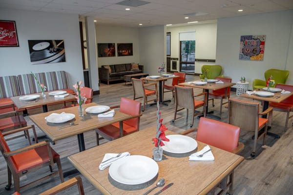 Dining area set up for a meal with empty plates