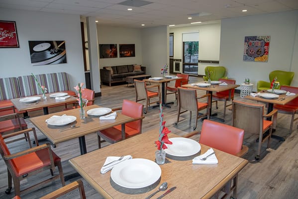Dining area set up for a meal with empty plates