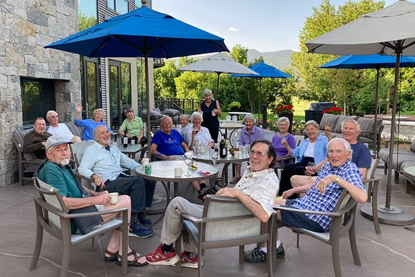 Residents enjoying an outdoor gathering on a patio