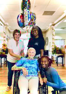 Residents and staff celebrating a birthday