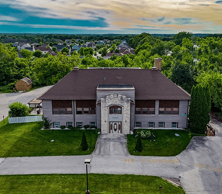 Aerial view of the Autumn Oaks building surrounded by greenery
