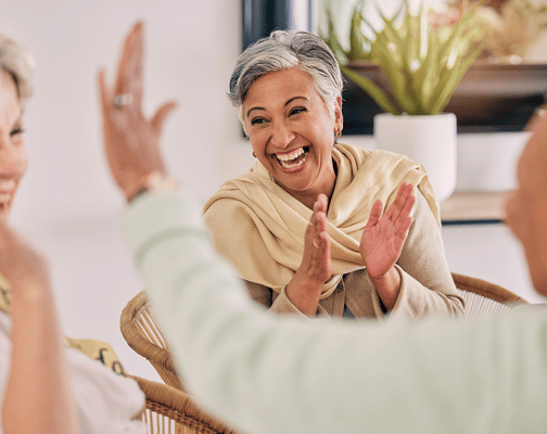 Residents enjoying a lively conversation indoors