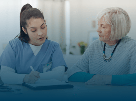 A staff member speaking with a resident