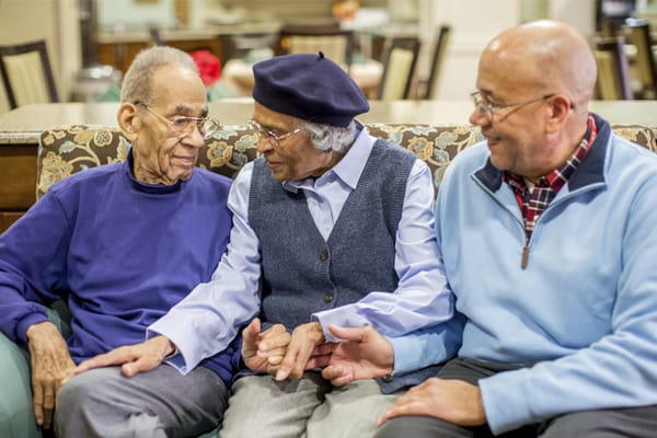 Residents and staff interacting in a common area