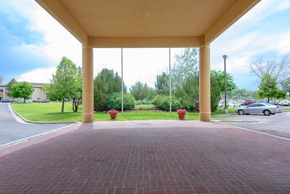 Entrance view into a landscaped area of the facility