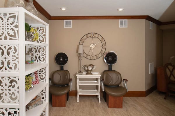 Interior view of a beauty/hair salon area with chairs