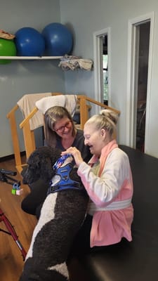 Resident interacting with a therapy dog during a session