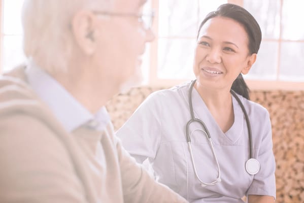 Healthcare professional interacting with an elderly resident