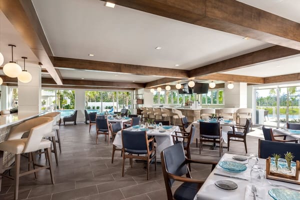 Dining area with modern decor and tables set for meals
